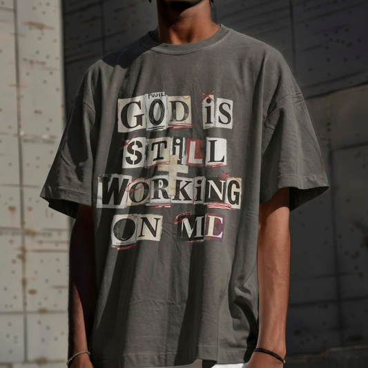 T-Shirt — "God Is Still Working On Me" Inspirational Faith Tee