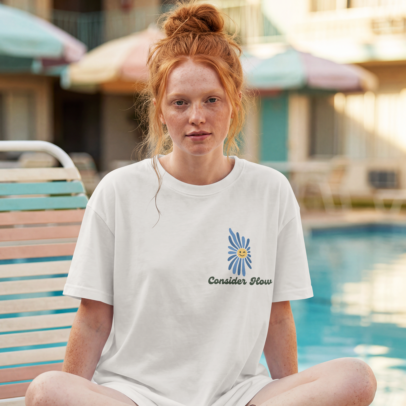 Consider How the Wildflowers Grow shirt front view with blue smiley daisy pocket print, Luke 12:27 Christian tee on white Comfort Colors